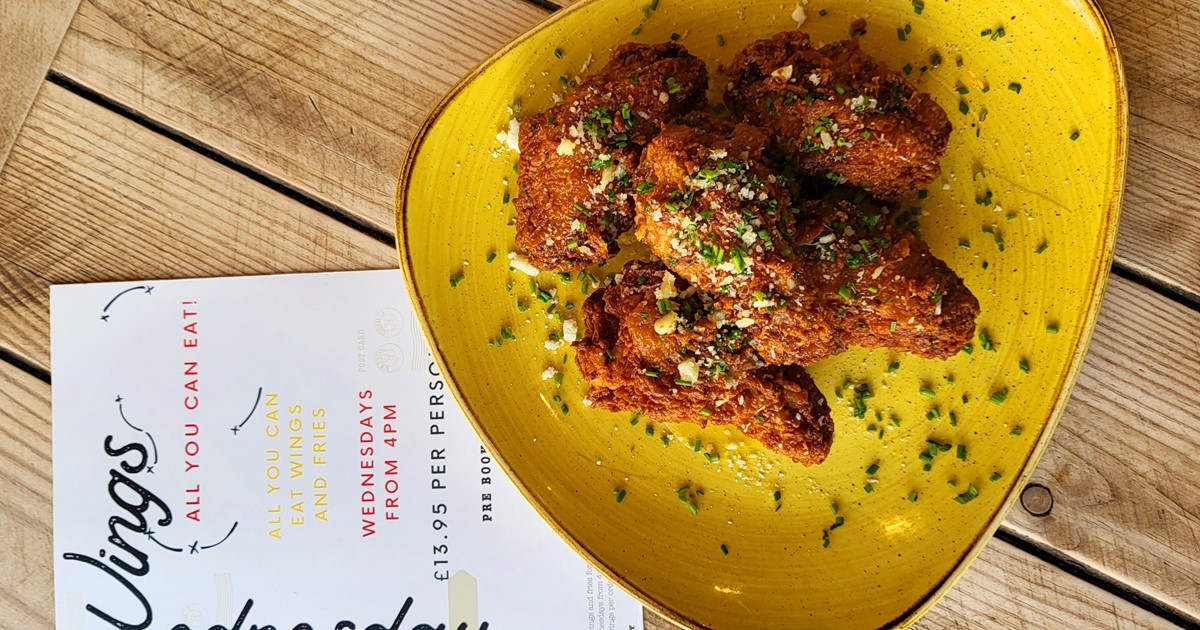 Guests enjoying Southern comfort food at Fancy Hank's York